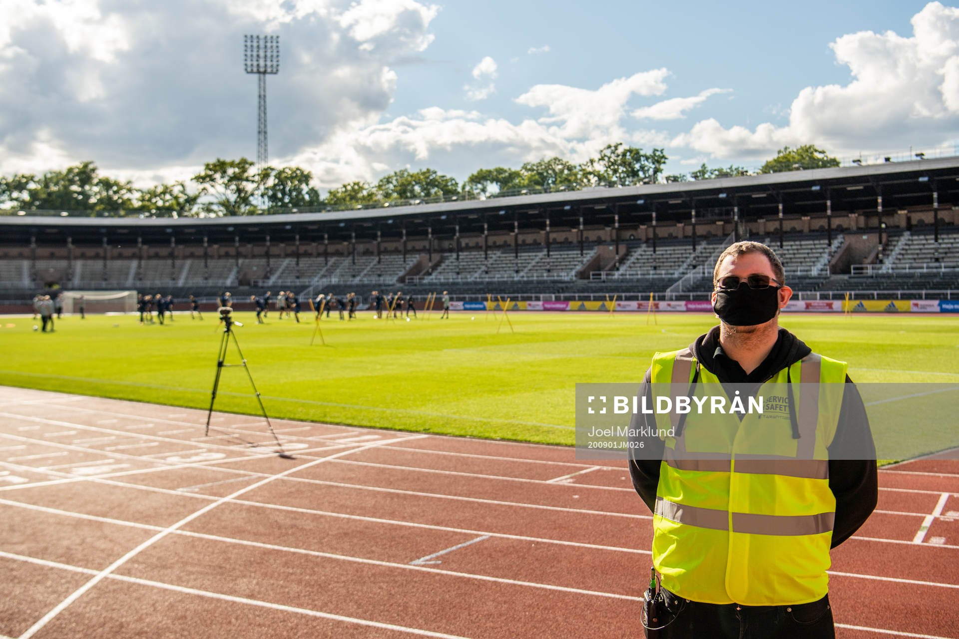 A security guard with a face mask