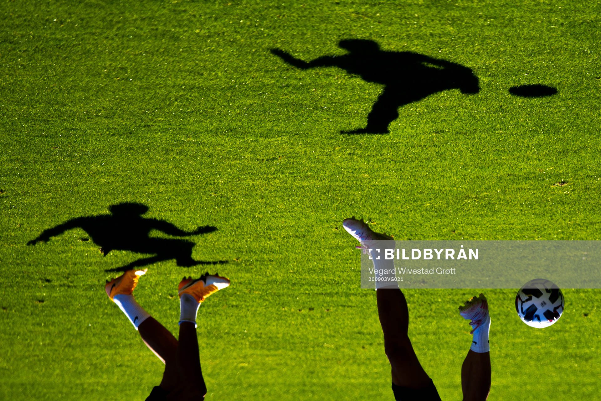 The shadows of Erling Braut Haaland and Tore Reginiussen of
