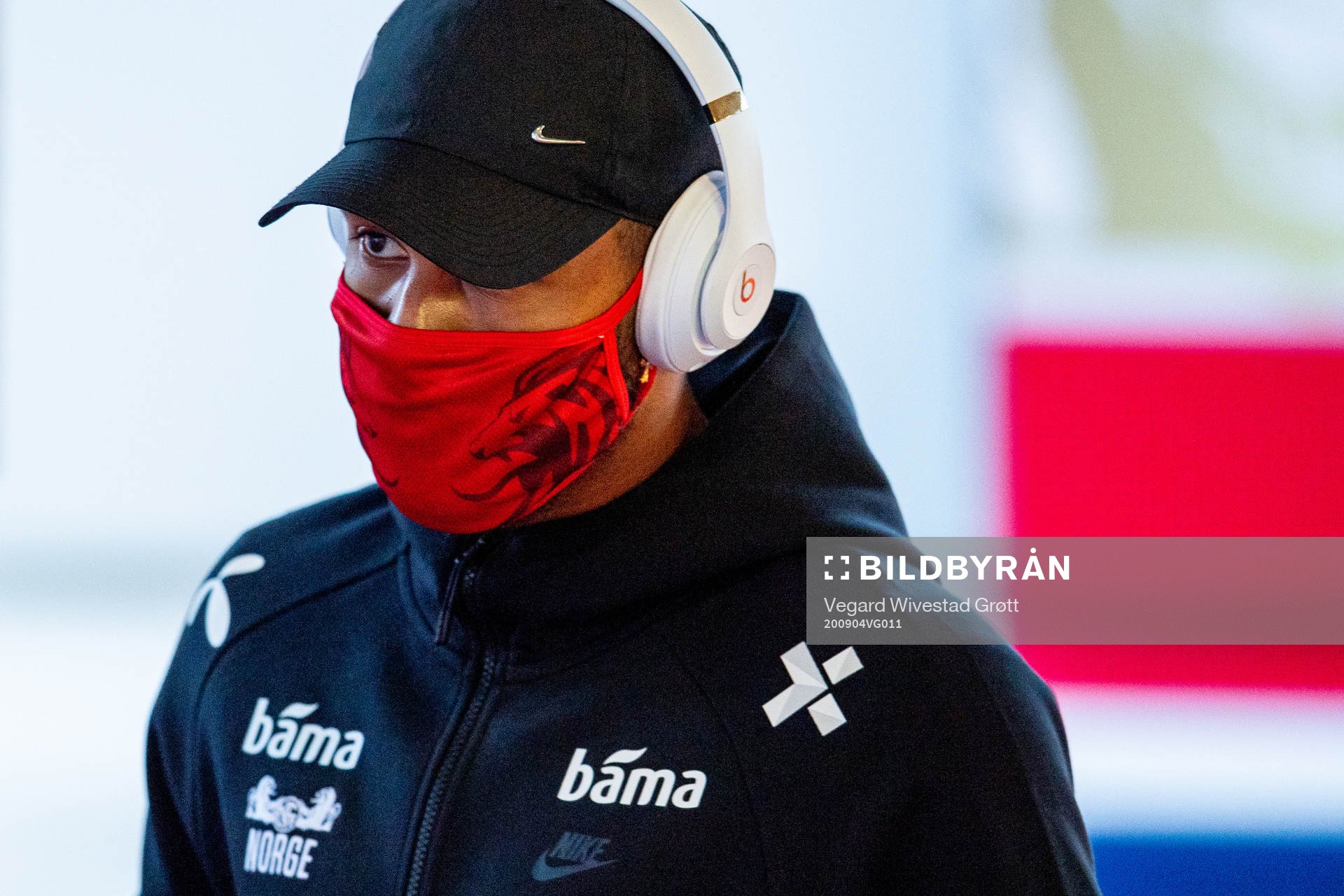 Joshua King of Norway arrives wearing a face mask
