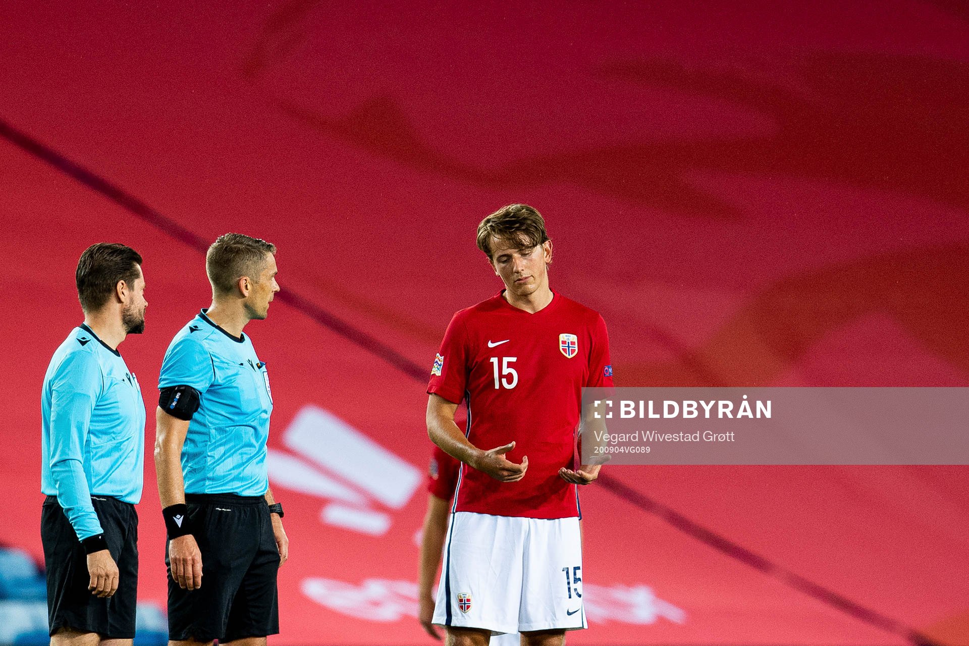 Sander Berge of Norway talks to referee Mattias Gestranius