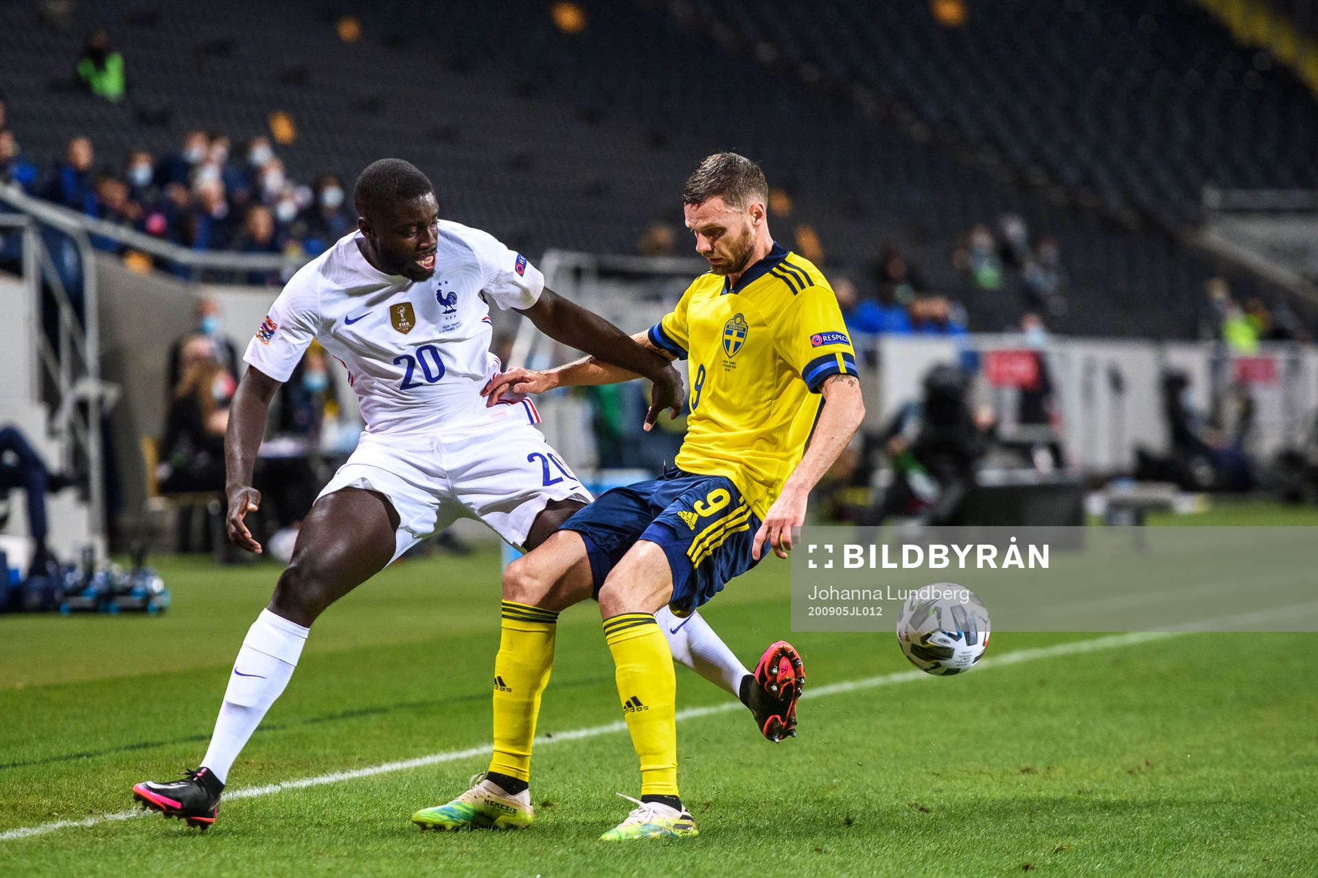 Dayot Upamecano of France and Marcus Berg of Sweden