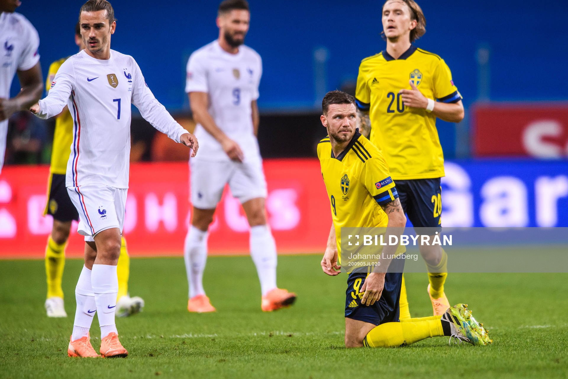 Antoine Griezmann of France and Marcus Berg of Sweden