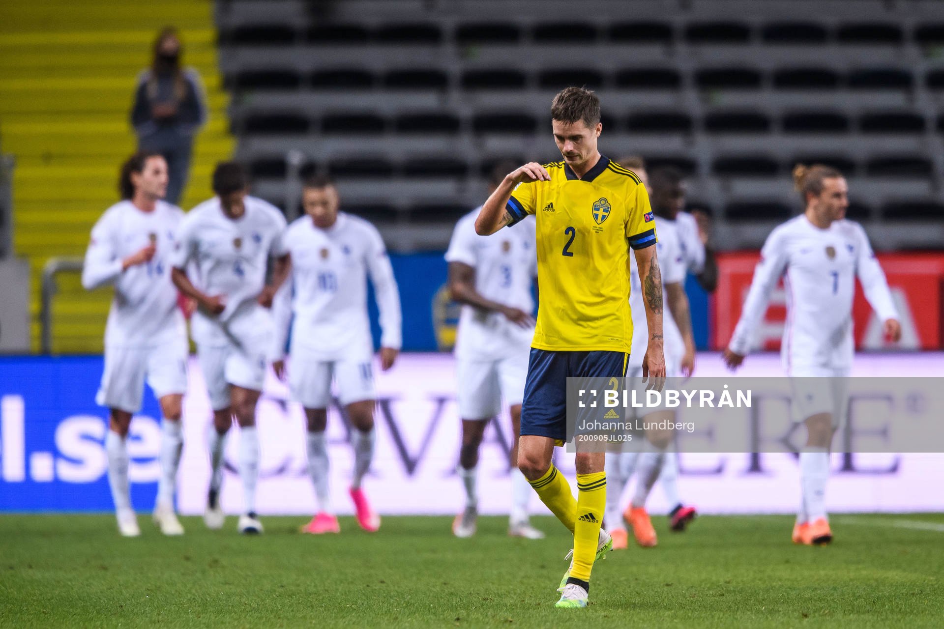 Mikael Lustig of Sweden looks dejected