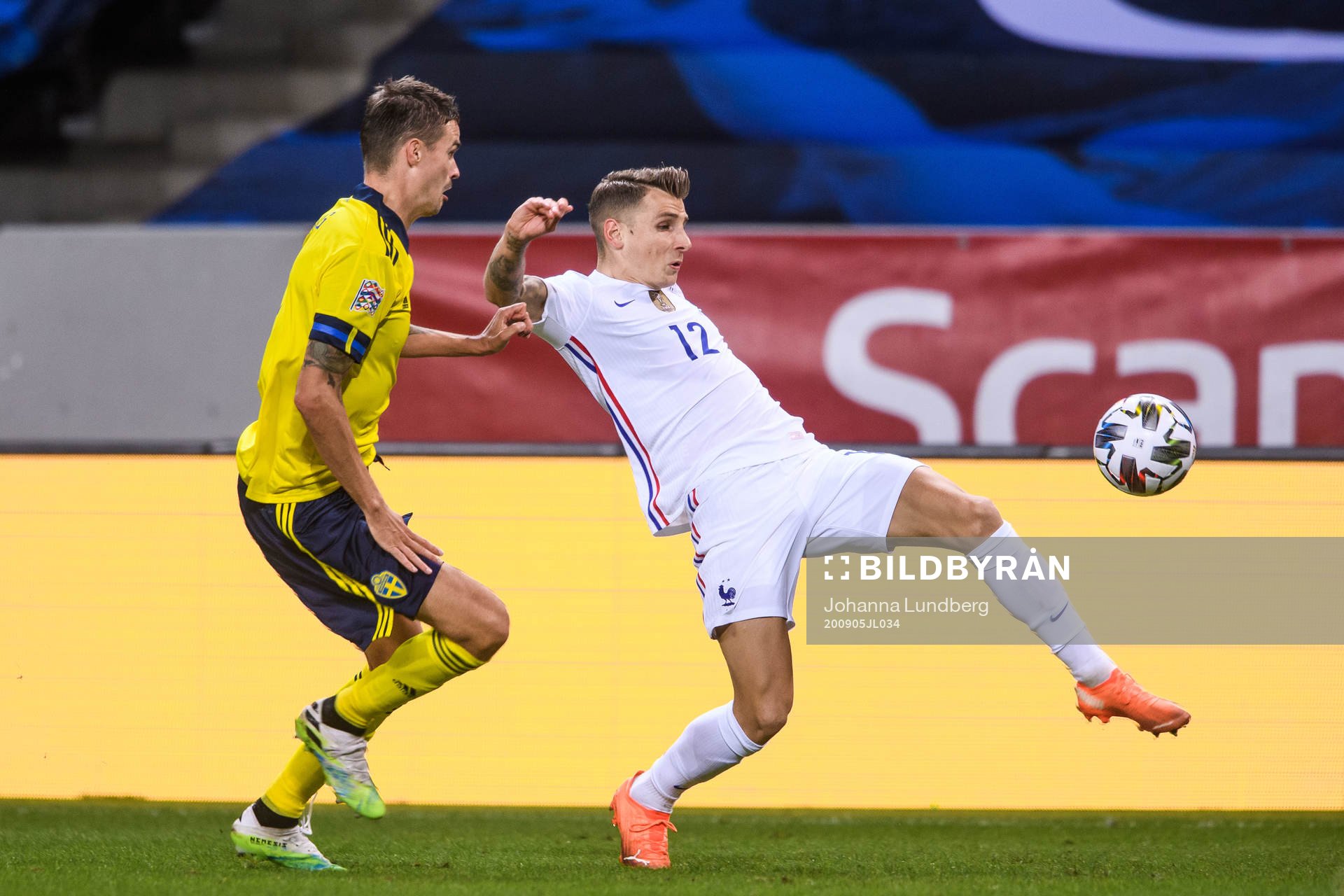 Mikael Lustig of Sweden and Lucas Digne of France