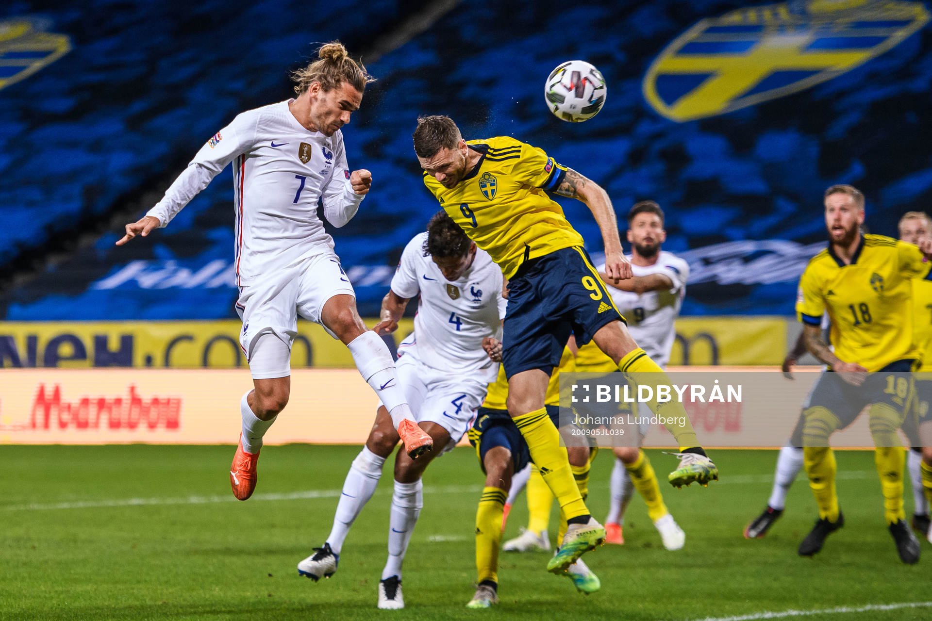 Antoine Griezmann of France and Marcus Berg of Sweden