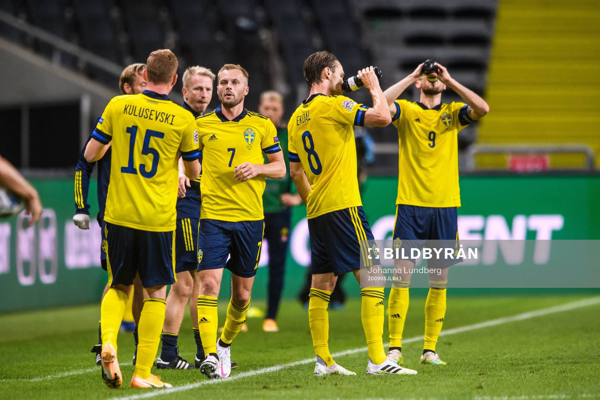 Sebastian Larsson of Sweden changes with Dejan Kulusevski