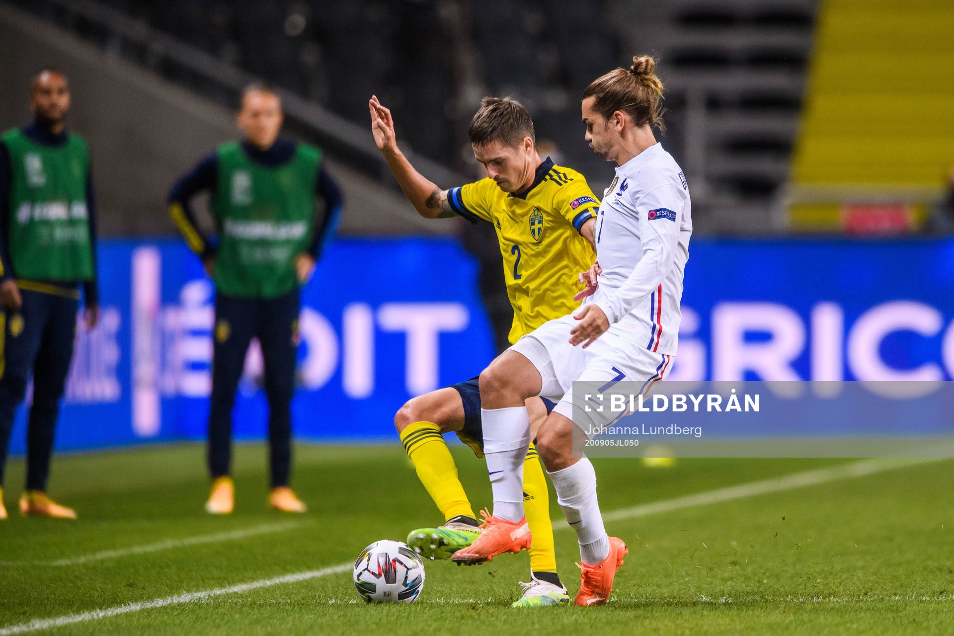 Mikael Lustig of Sweden and Antoine Griezmann of France