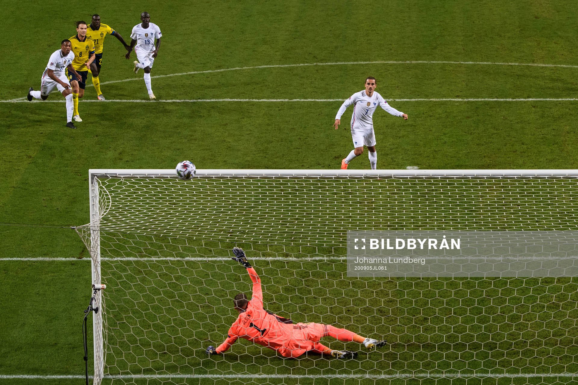 Antoine Griezmann of France misses a penalty behind