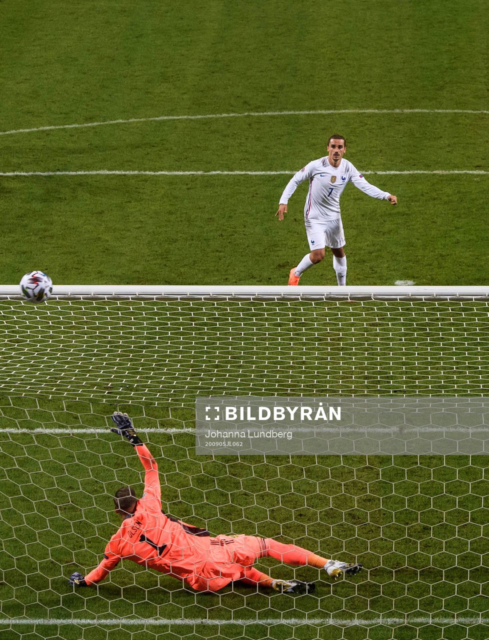 Antoine Griezmann of France misses a penalty behind