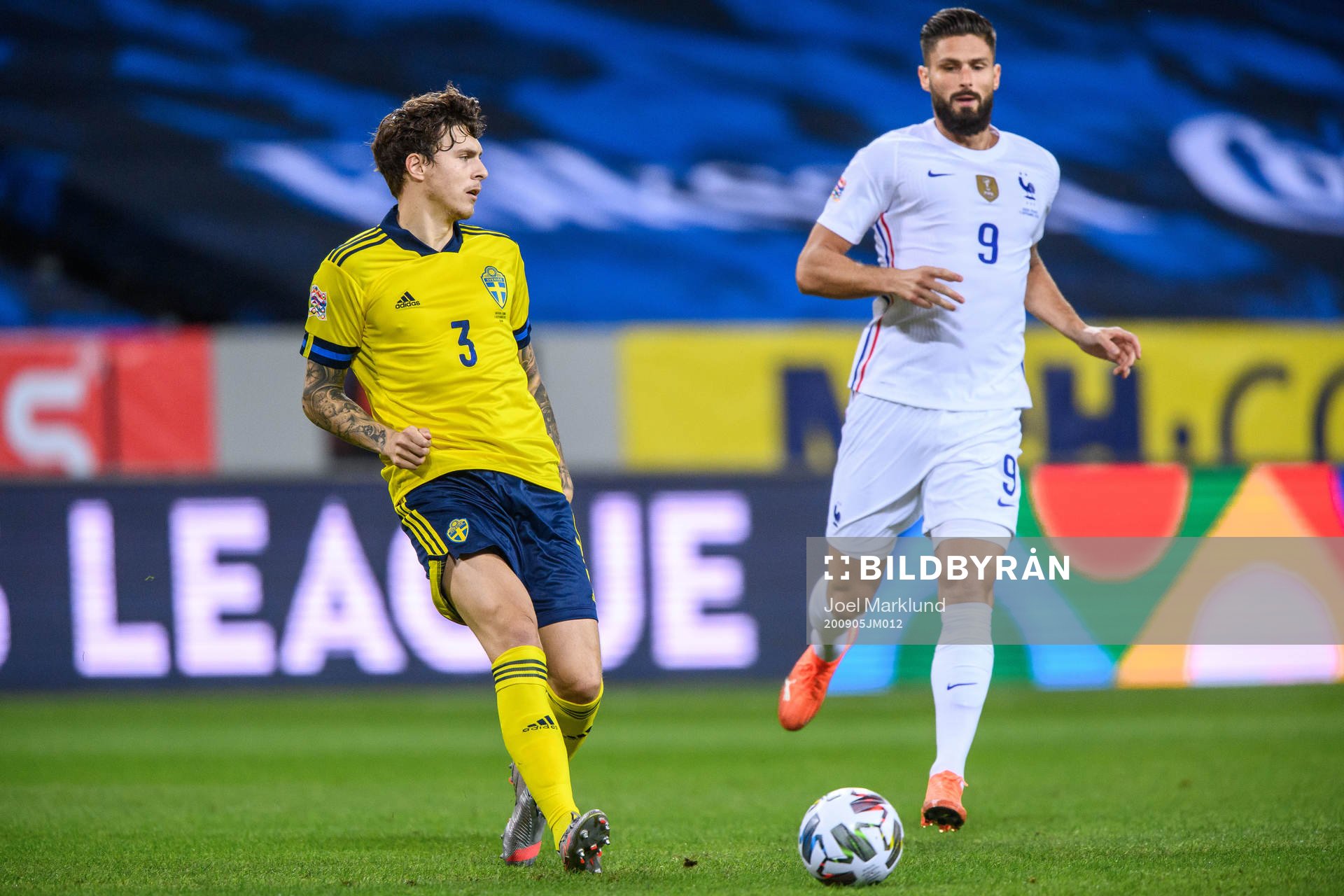 Victor Nilsson Lindelöf of Sweden and Olivier Giroud of