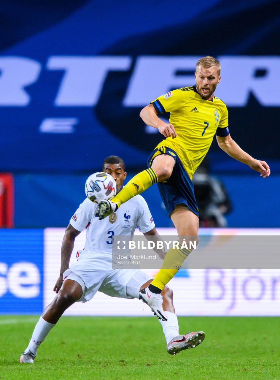 Presnel Kimpembe of France and Sebastian Larsson of Sweden