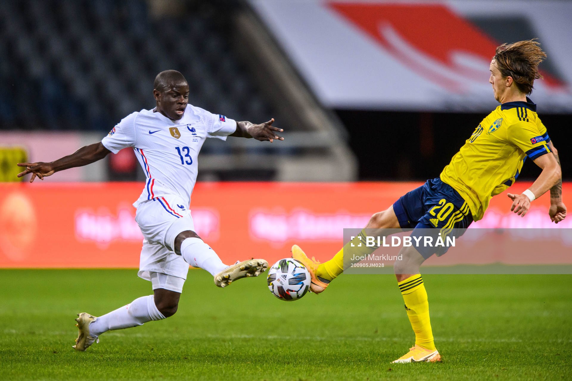 N'Golo Kanté of France and Kristoffer Olsson of Sweden