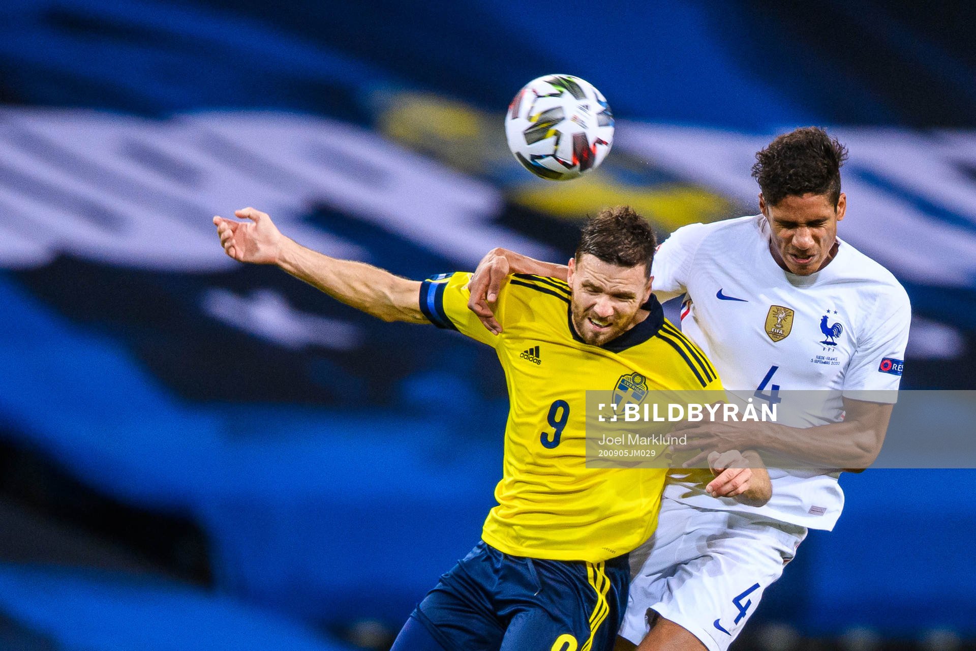 Marcus Berg of Sweden and Raphaël Varane of France