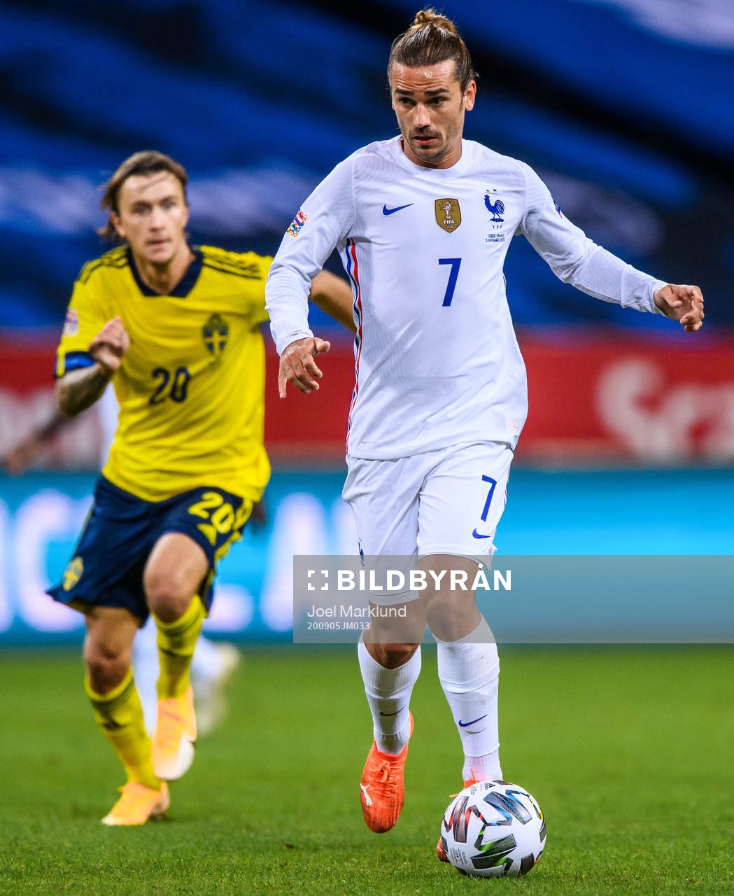 Kristoffer Olsson of Sweden and Antoine Griezmann of France