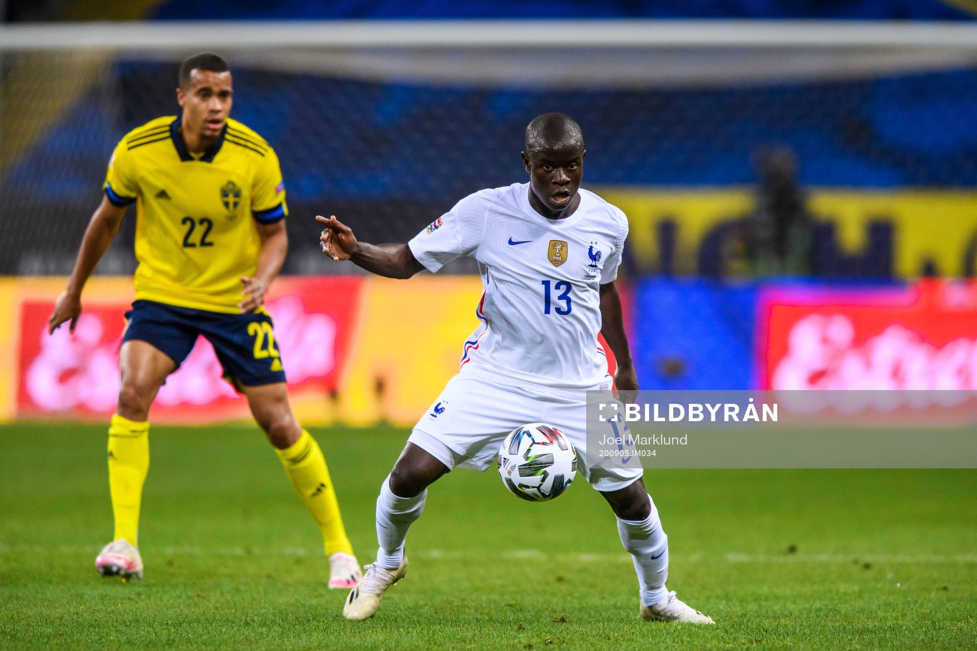 Robin Quaison of Sweden and N'Golo Kanté of France