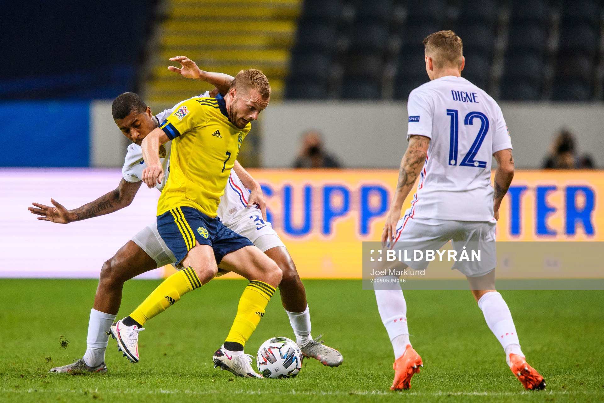Presnel Kimpembe of France and Sebastian Larsson of Sweden