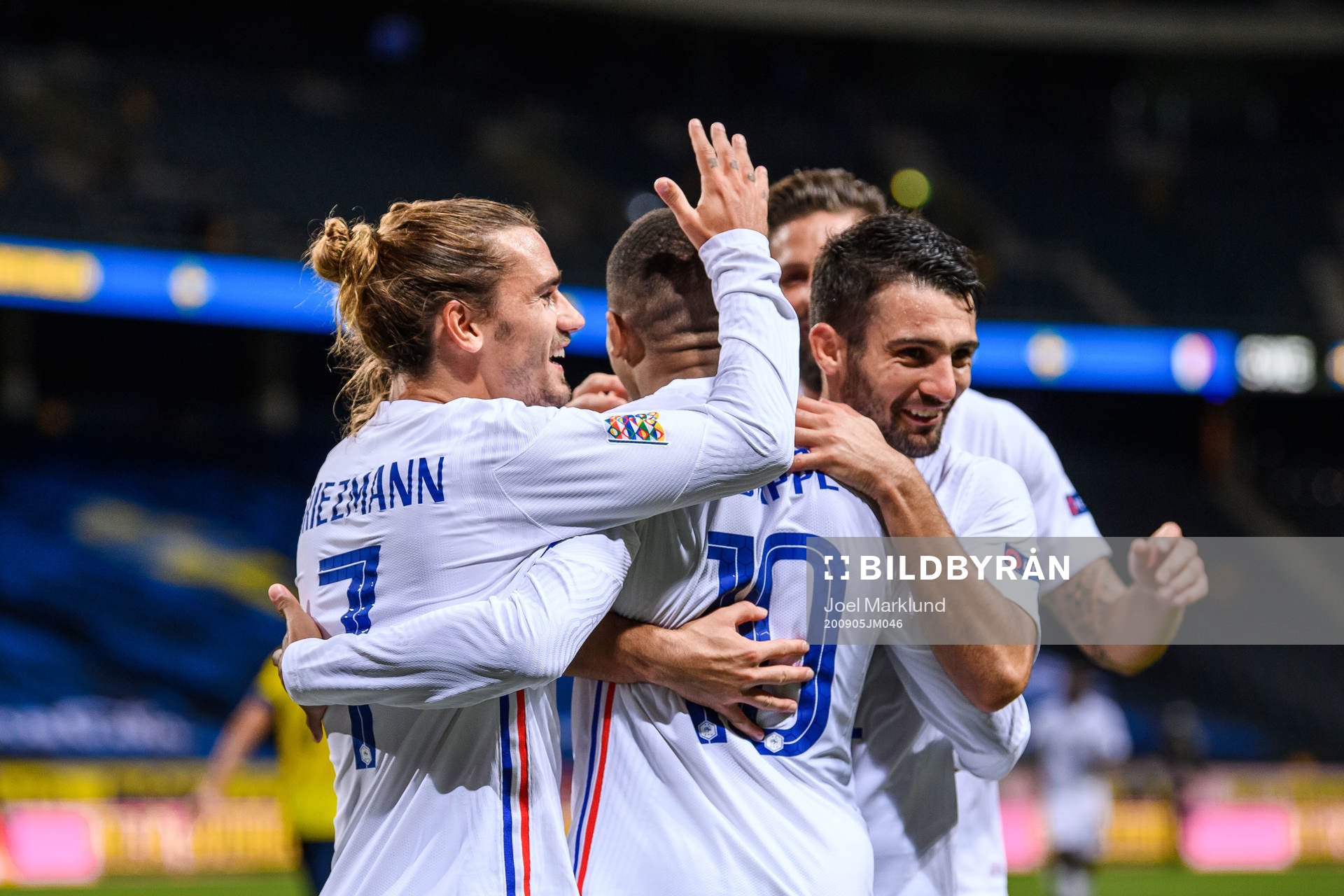 Antoine Griezmann, Kylian Mbappé and Léo Dubois of France
