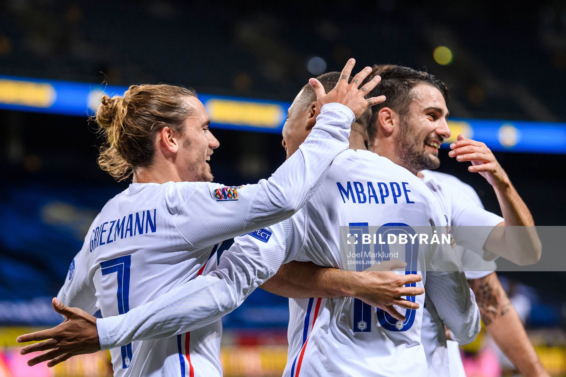 Antoine Griezmann, Kylian Mbappé and Léo Dubois of France