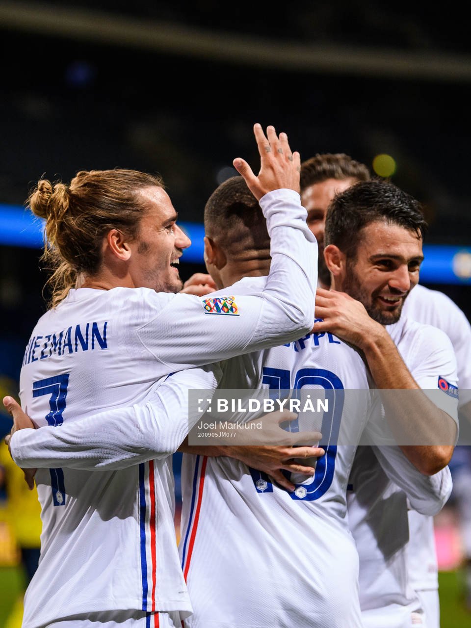 Antoine Griezmann, Kylian Mbappé and Léo Dubois of France