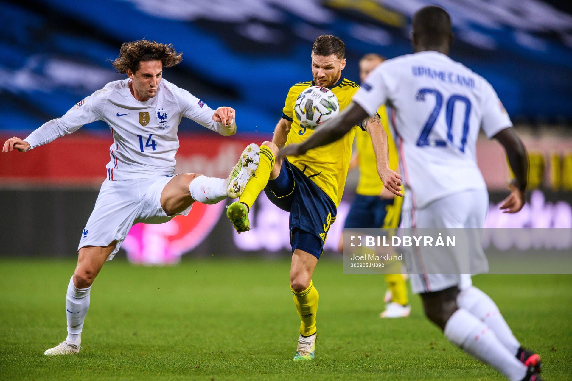 Adrien Rabiot of France and Marcus Berg of Sweden