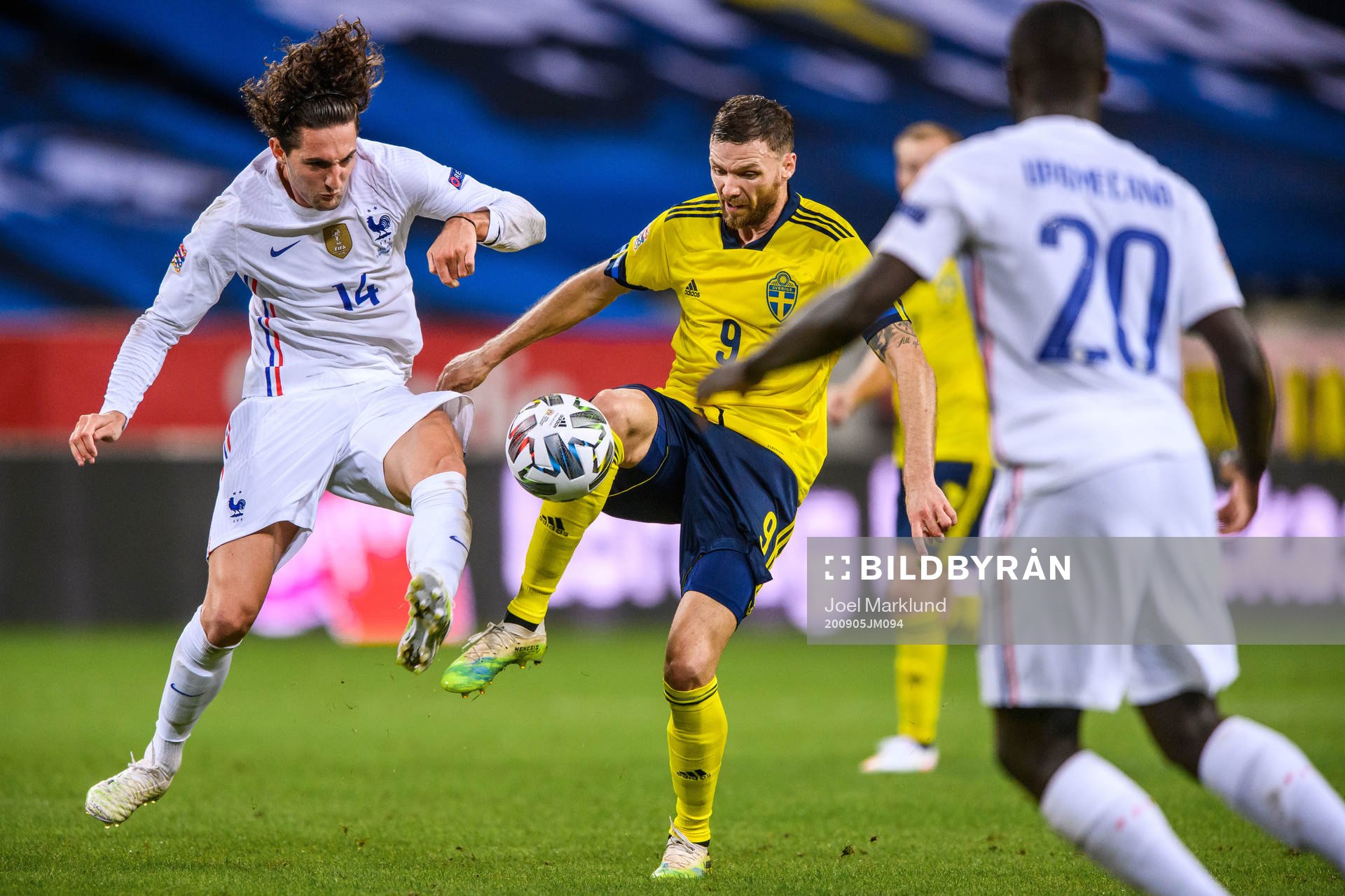 Adrien Rabiot of France and Marcus Berg of Sweden