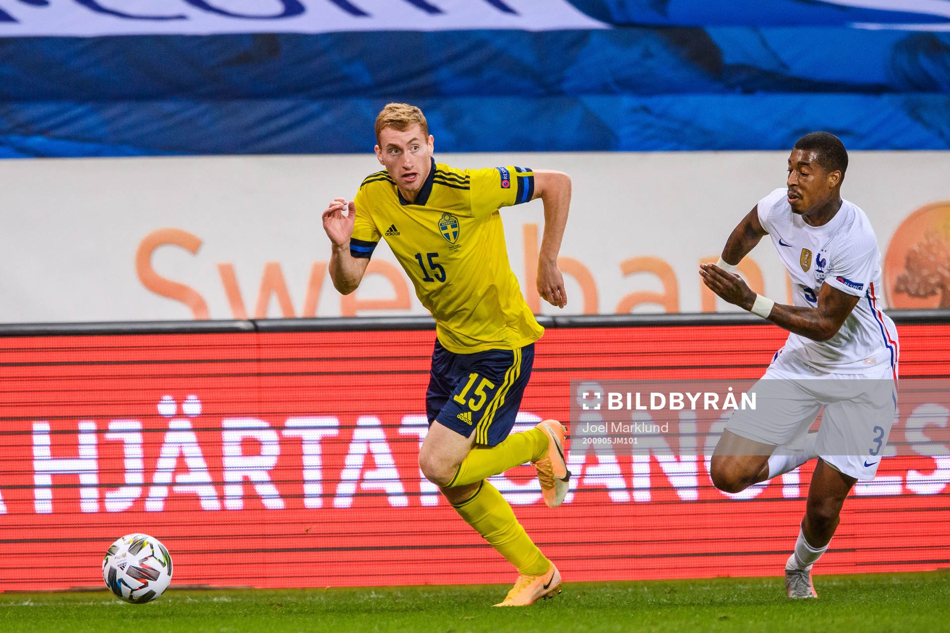 Dejan Kulusevski of Sweden and Presnel Kimpembe of France