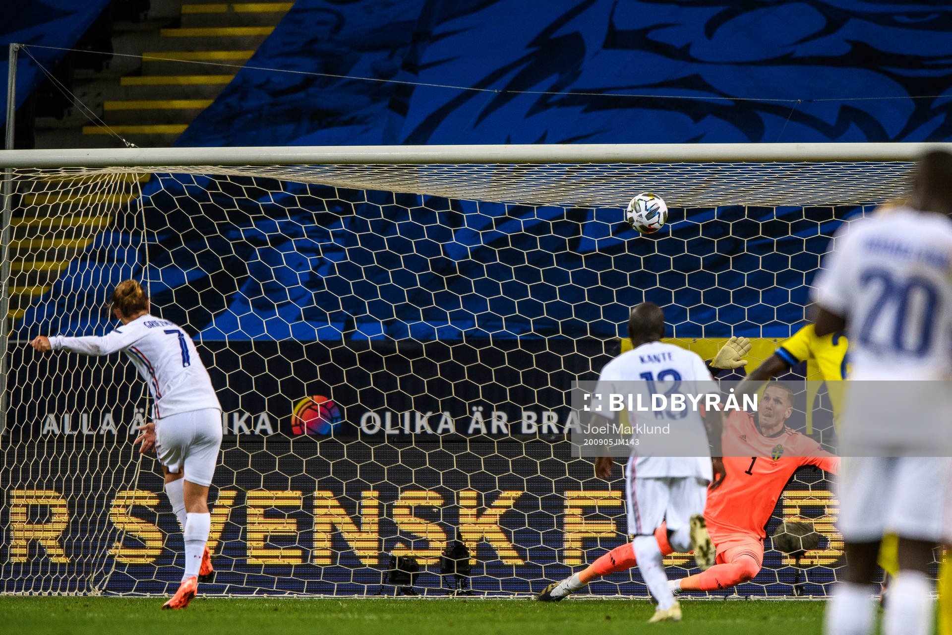 Antoine Griezmann of France misses a penalty behind