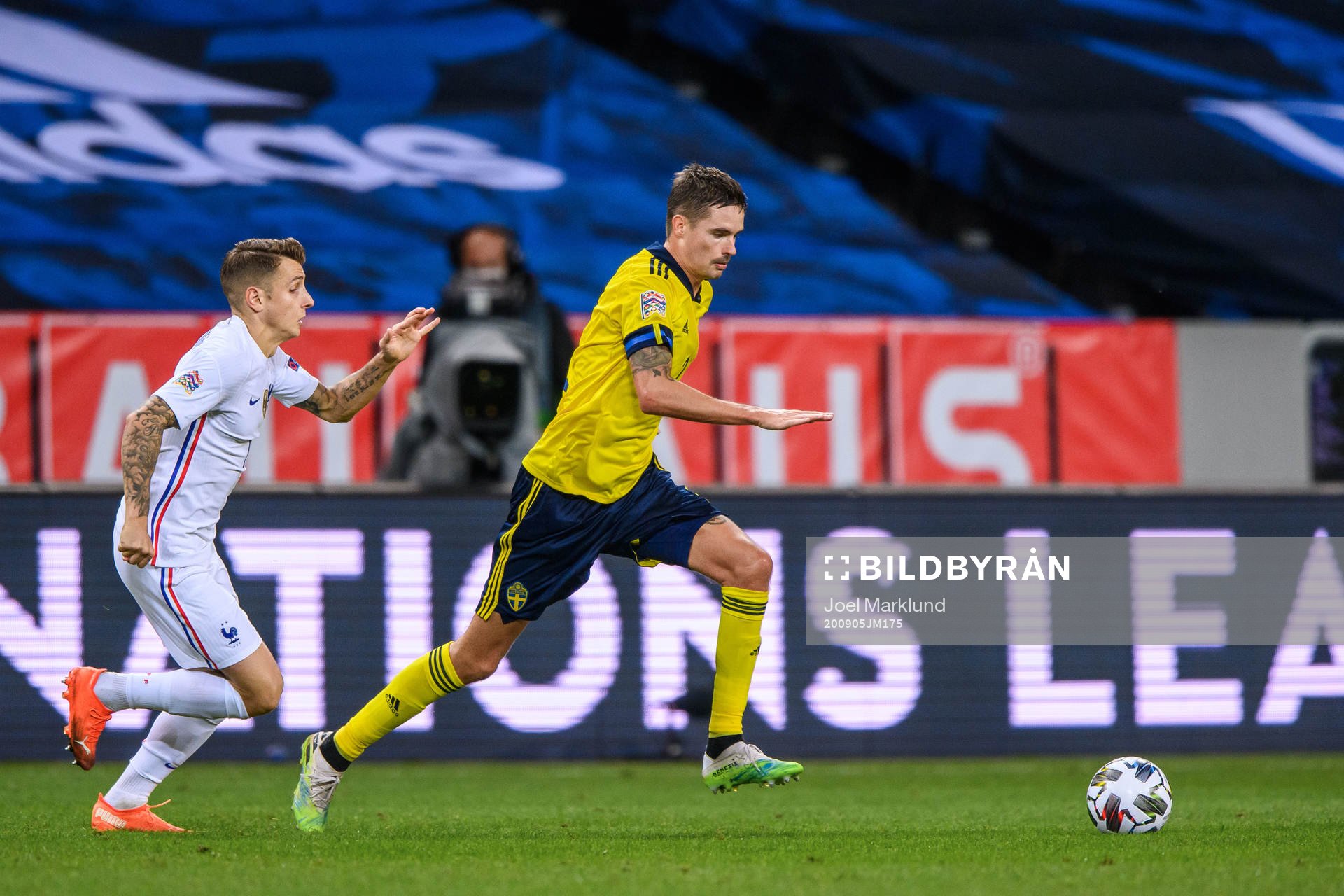Lucas Digne of France and Mikael Lustig of Sweden