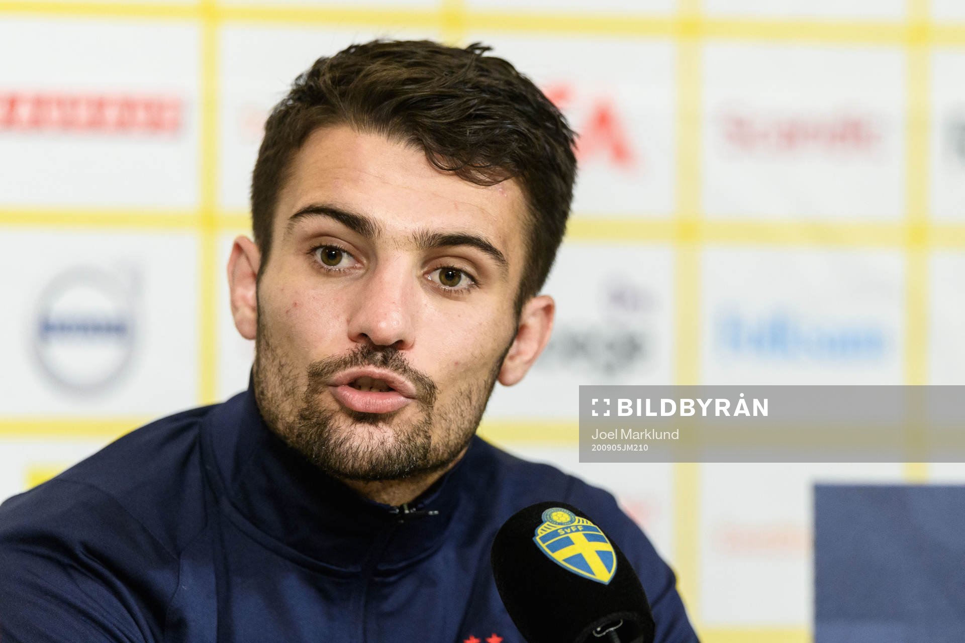 Léo Dubois of France at a press conference