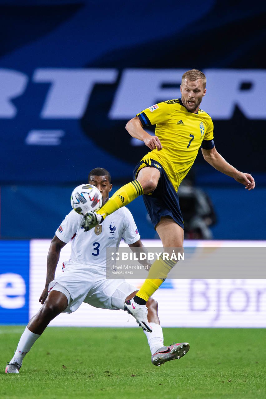 Presnel Kimpembe of France and Sebastian Larsson of Sweden