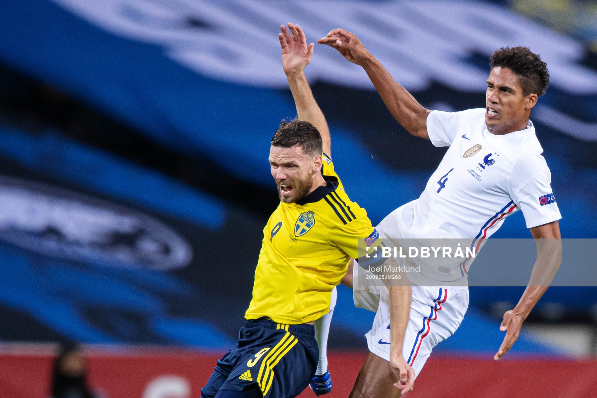 Marcus Berg of Sweden and Raphaël Varane of France