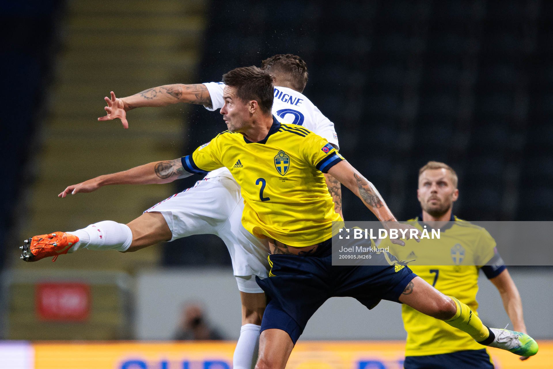Lucas Digne of France and Mikael Lustig of Sweden
