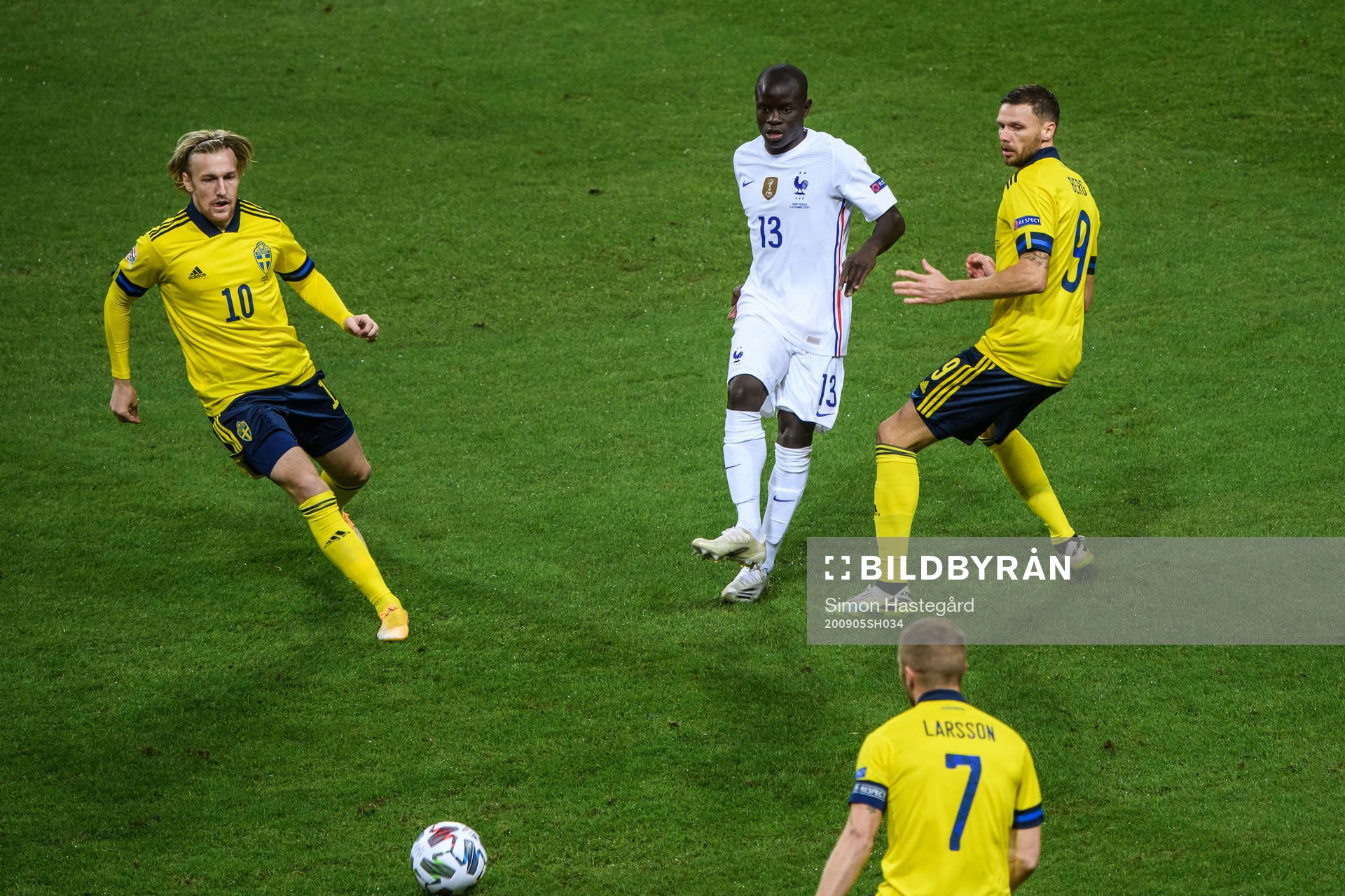 Emil Forsberg and Marcus Berg of Sweden against N'Golo