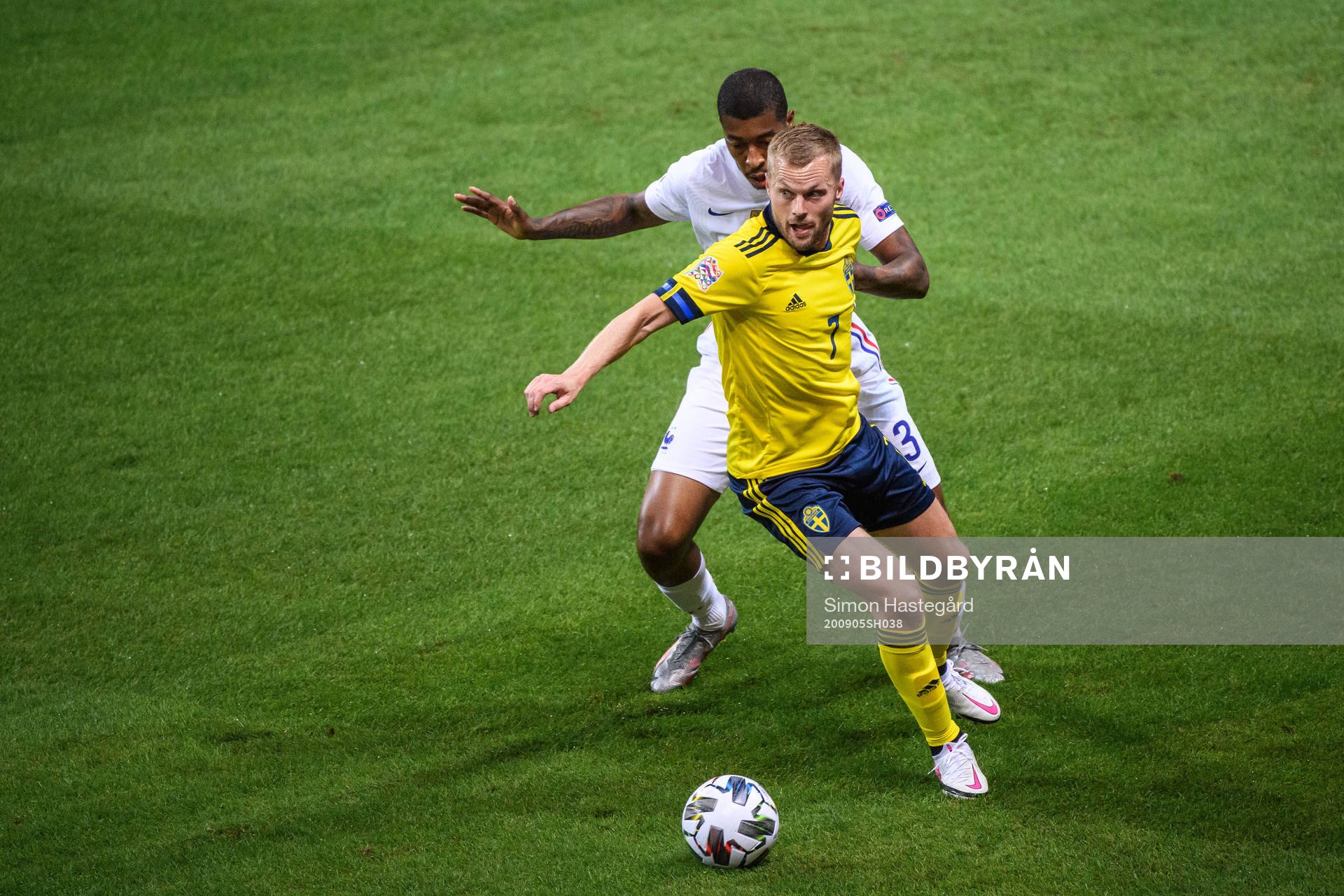 Sebastian Larsson of Sweden and Presnel Kimpembe of France