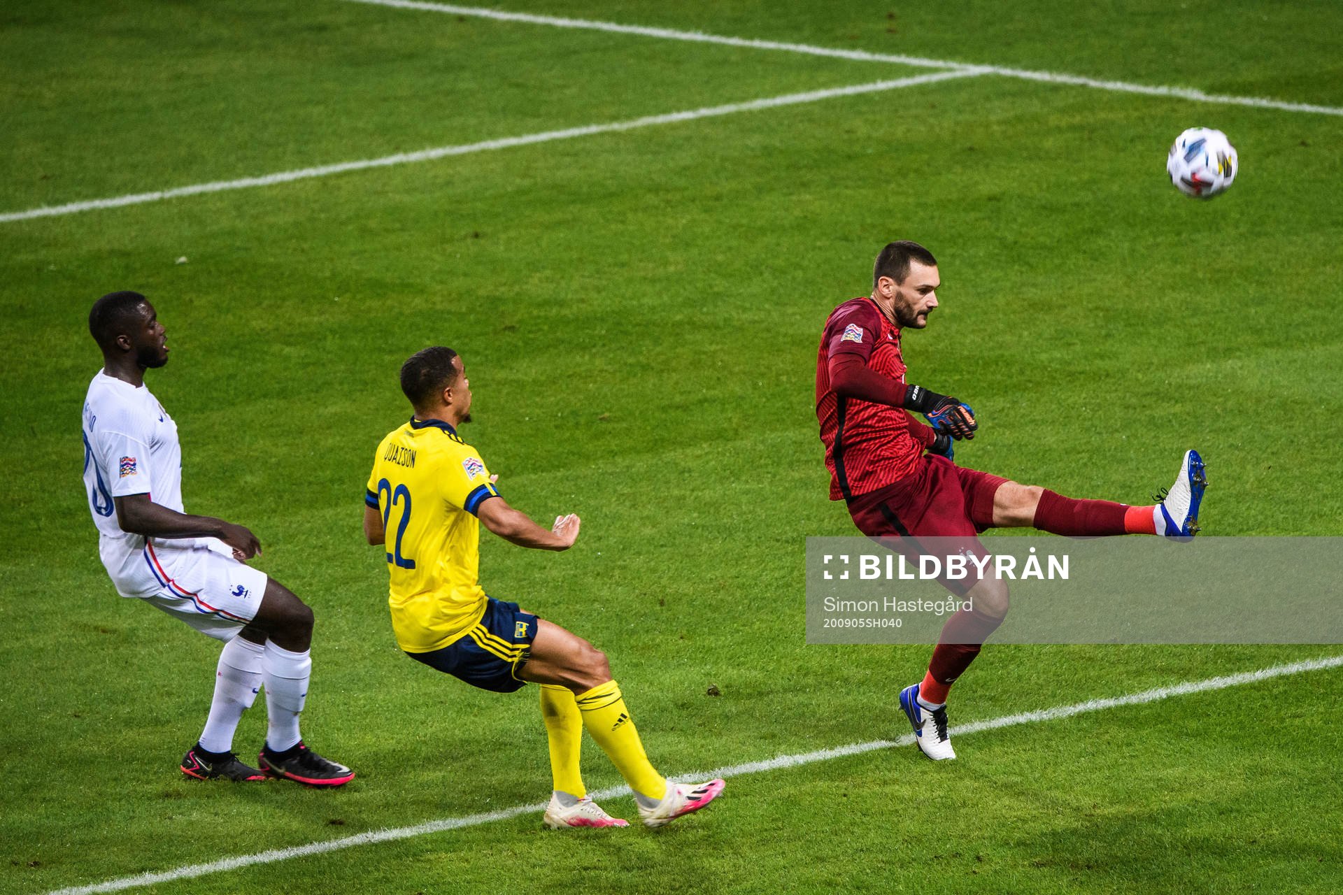 Goalkeeper Hugo Llorisof France and Robin Quaison of Sweden