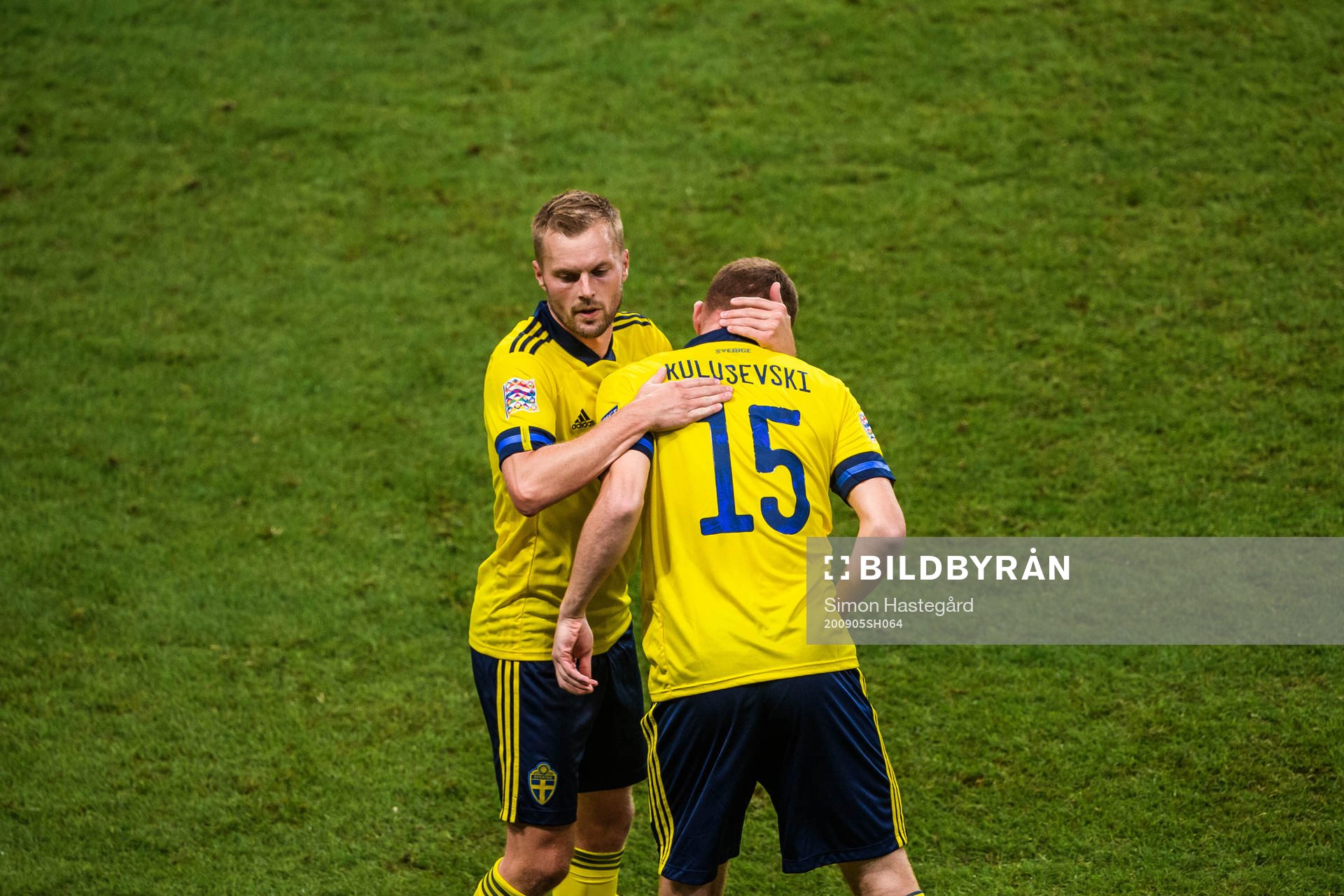 Sebastian Larsson changes with Dejan Kulusevski of Sweden