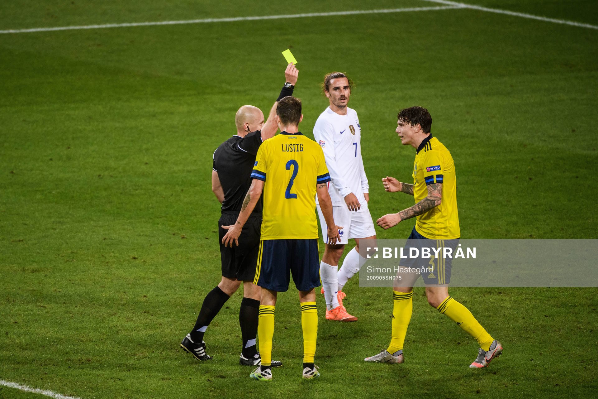 Victor Nilsson Lindelöf of Sweden receives a warning from