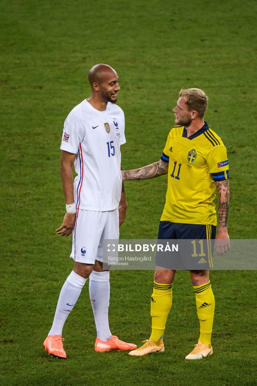 Steven Nzonzi of France and John Guidetti of Sweden