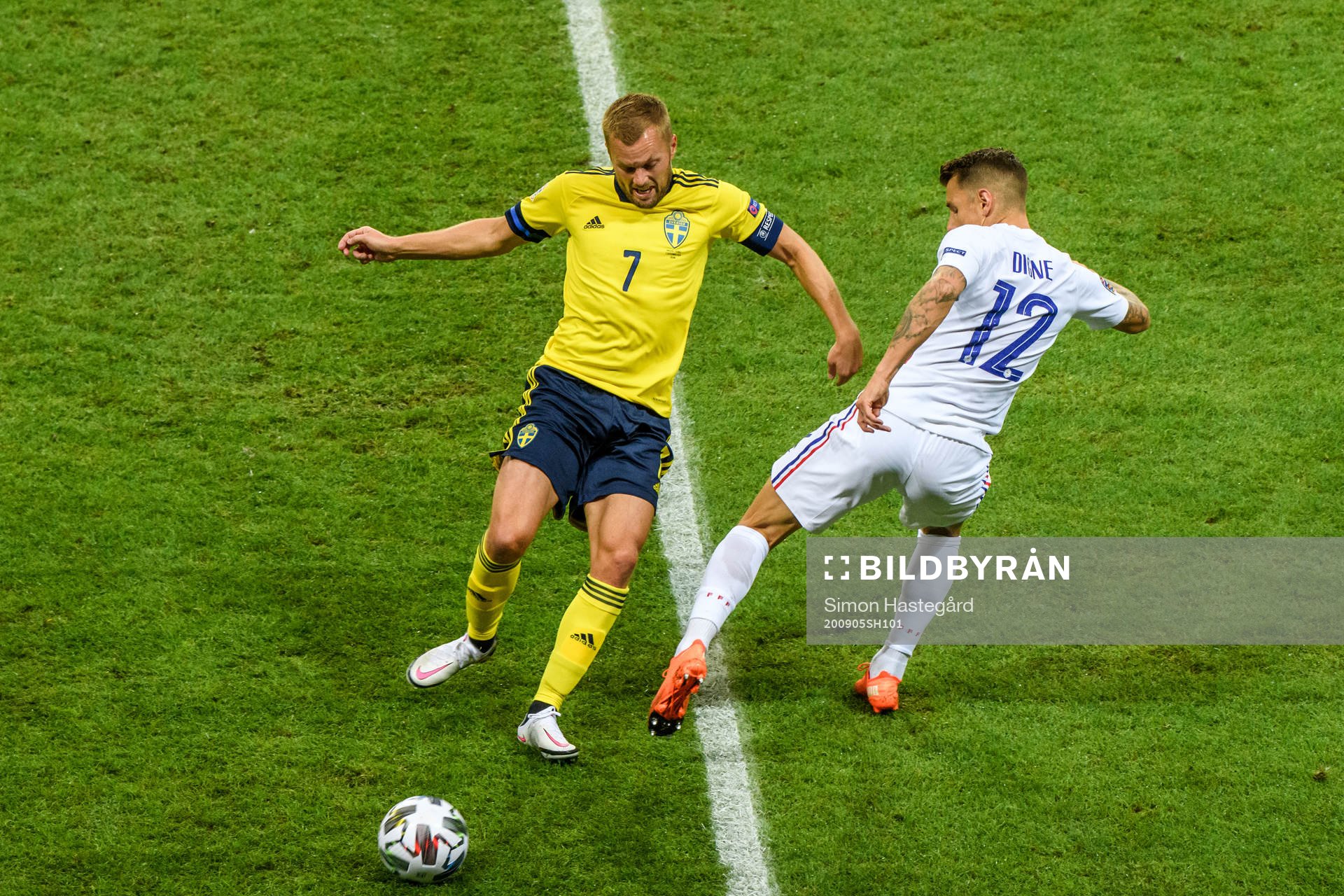 Sebastian Larsson of Sweden and Lucas Digne of France