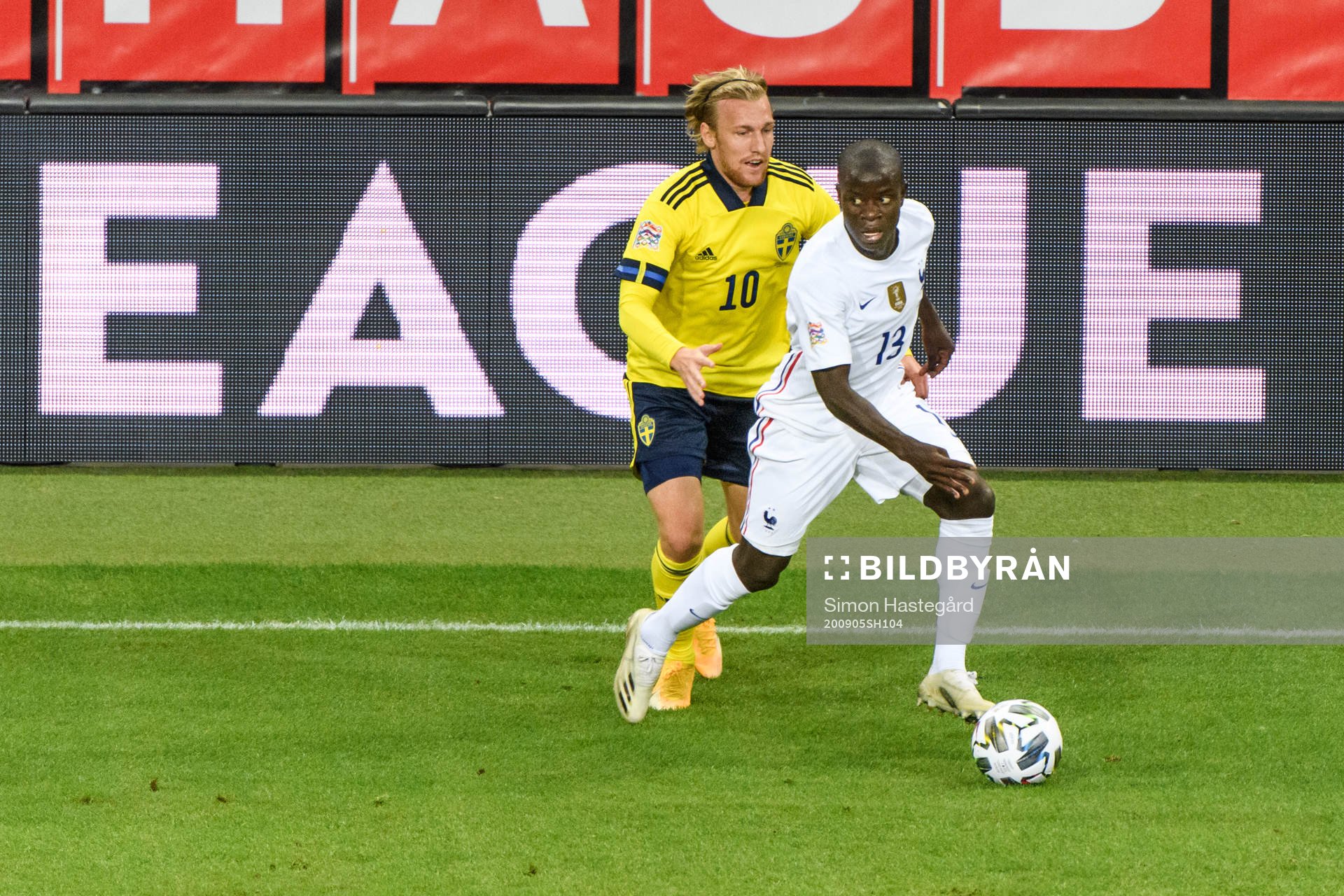 Emil Forsberg of Sweden and N'Golo Kanté of France