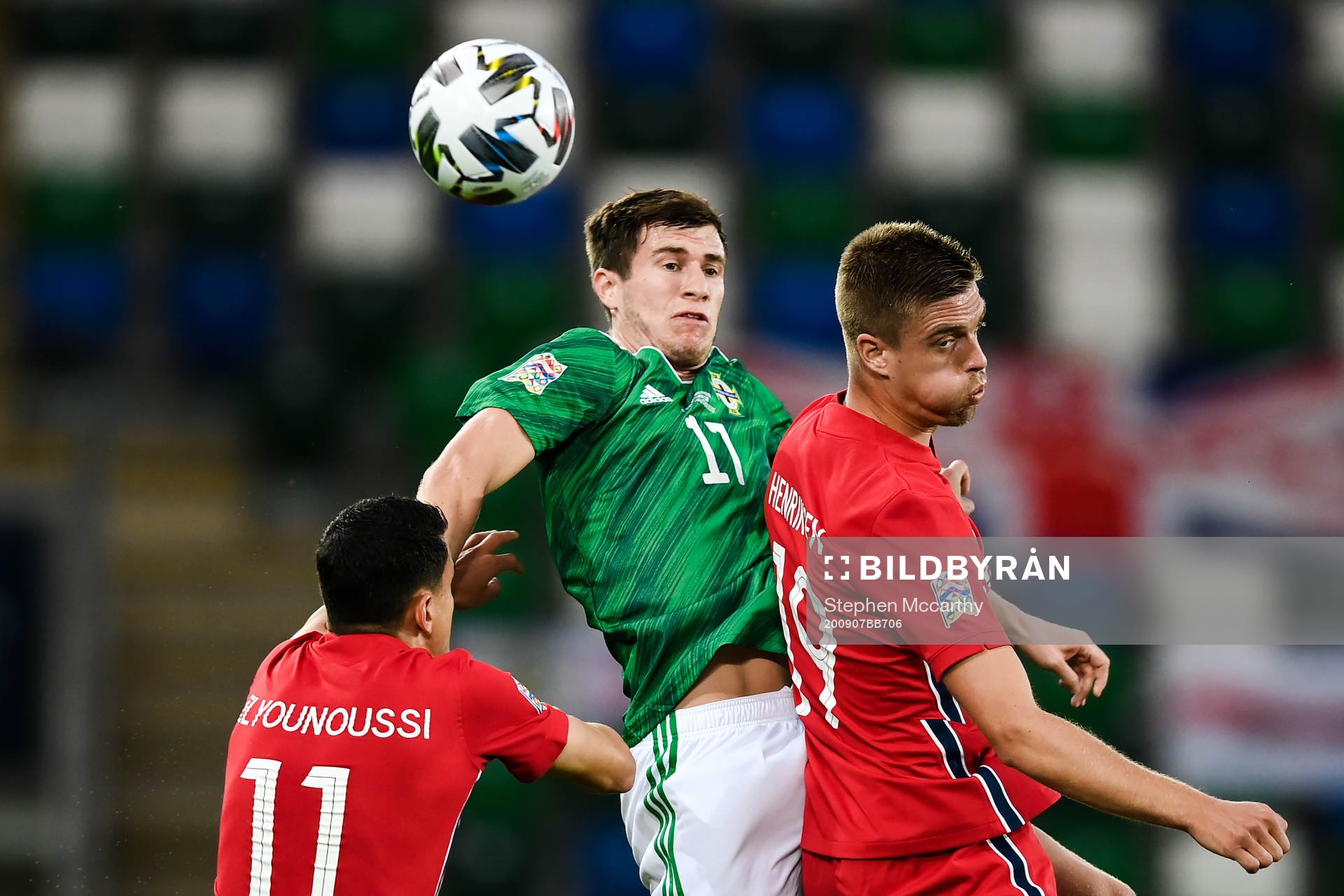Paddy McNair of Northern Ireland and Markus Henriksen of