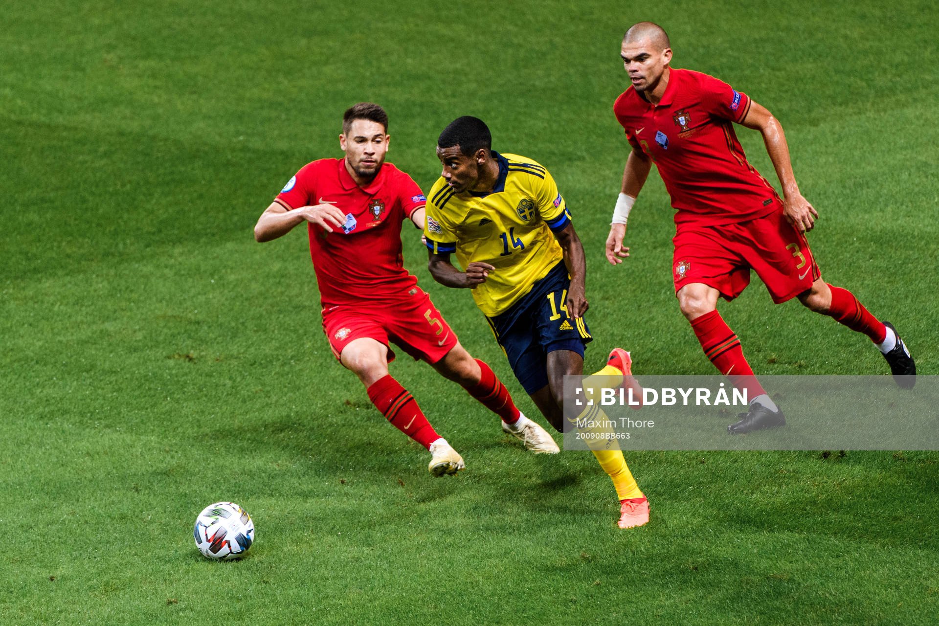 Alexander Isak of Sweden against Raphael Guerreiro and Pepe