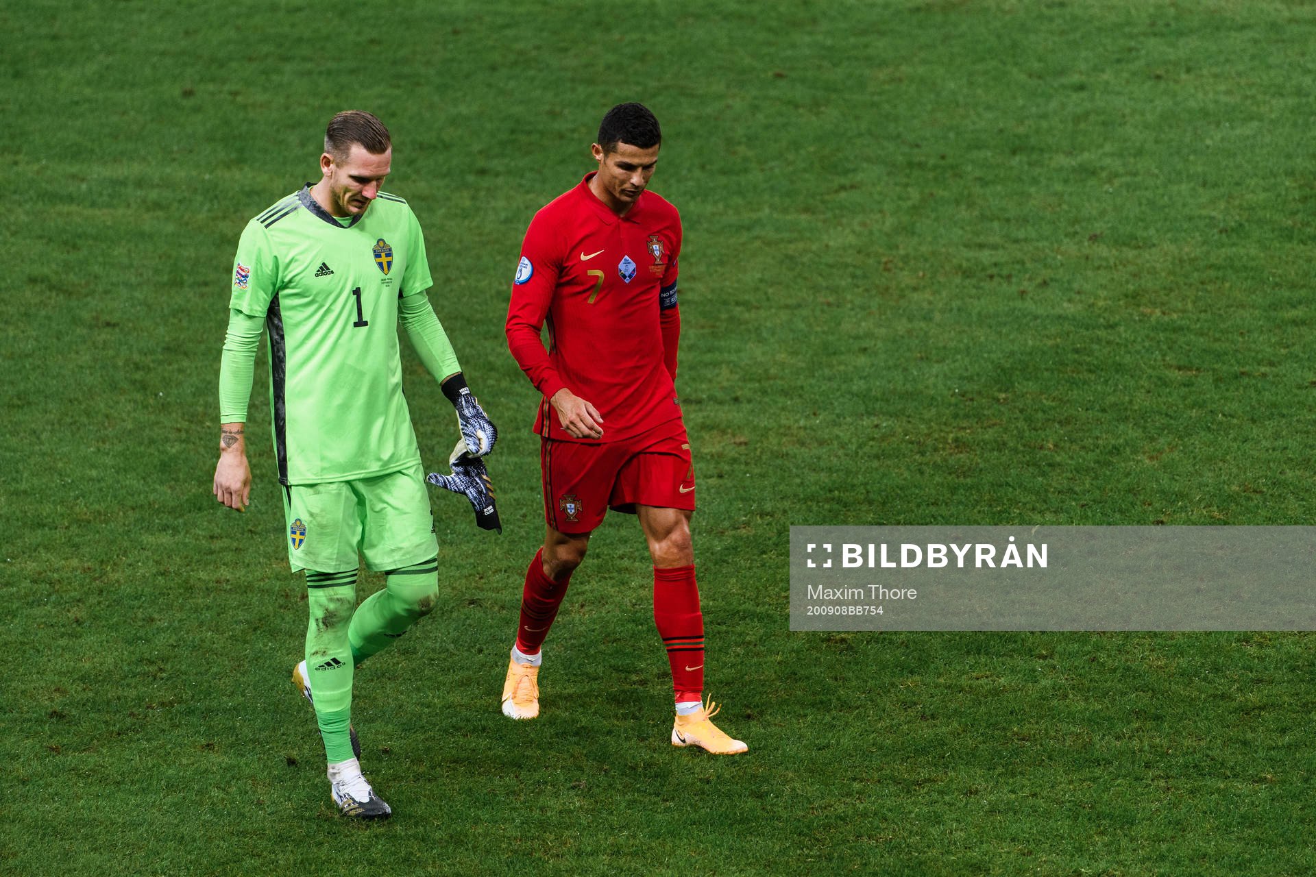 Goalkeeper Robin Olsen of Sweden and Cristiano Ronaldo of