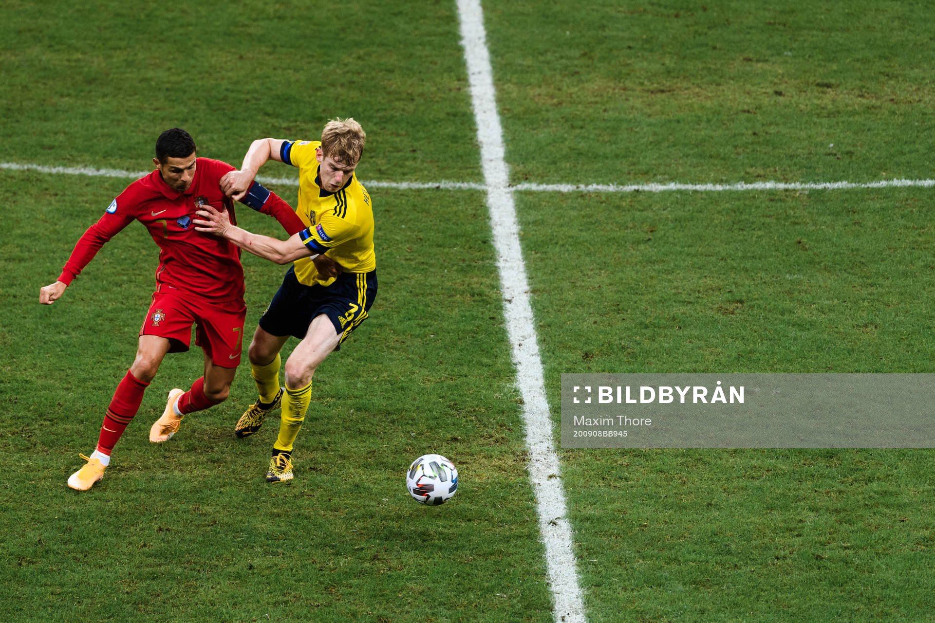 Cristiano Ronaldo of Portugal and Filip Helander of Sweden