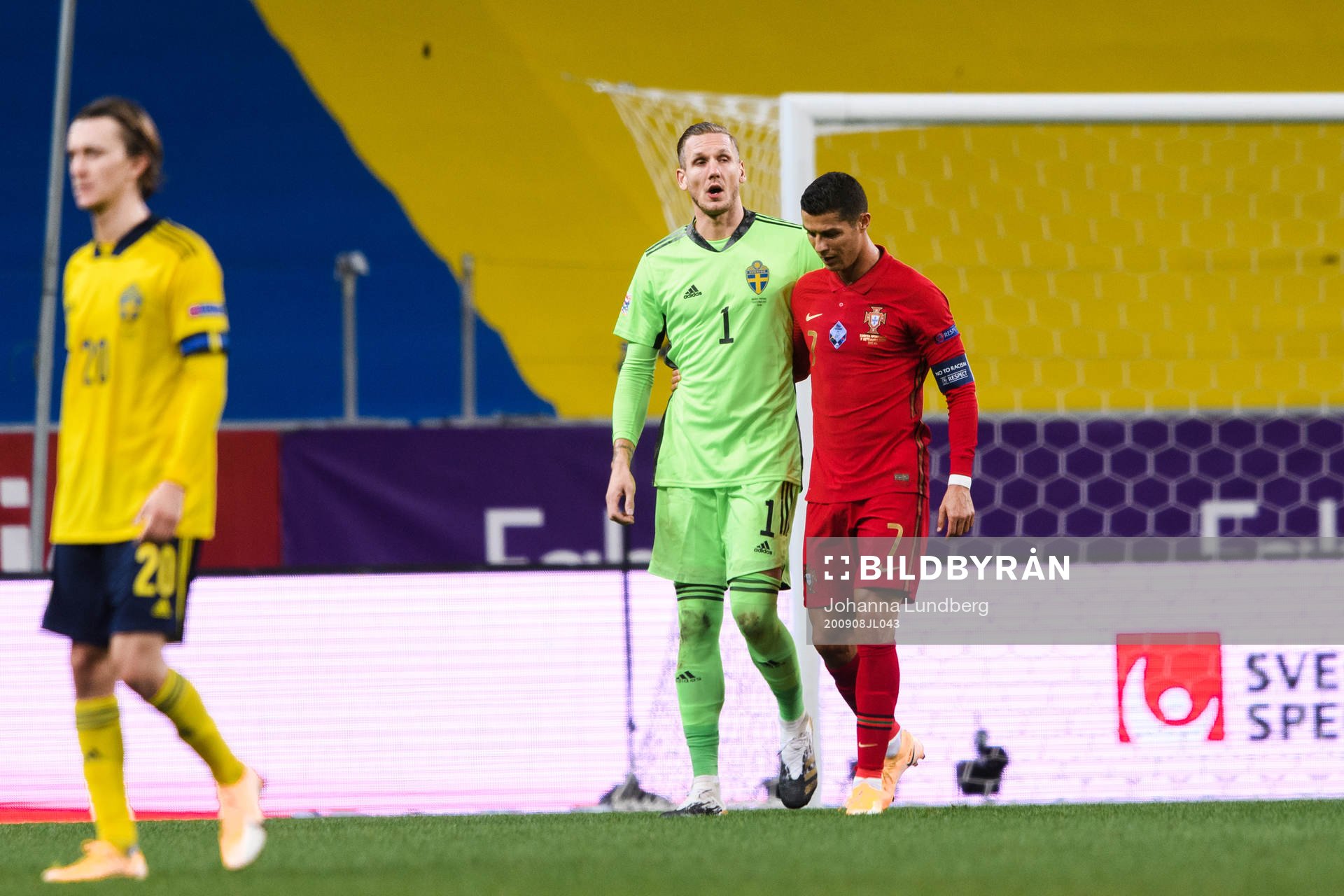 Goalkeeper Robin Olsen of Sweden and Cristiano Ronaldo of