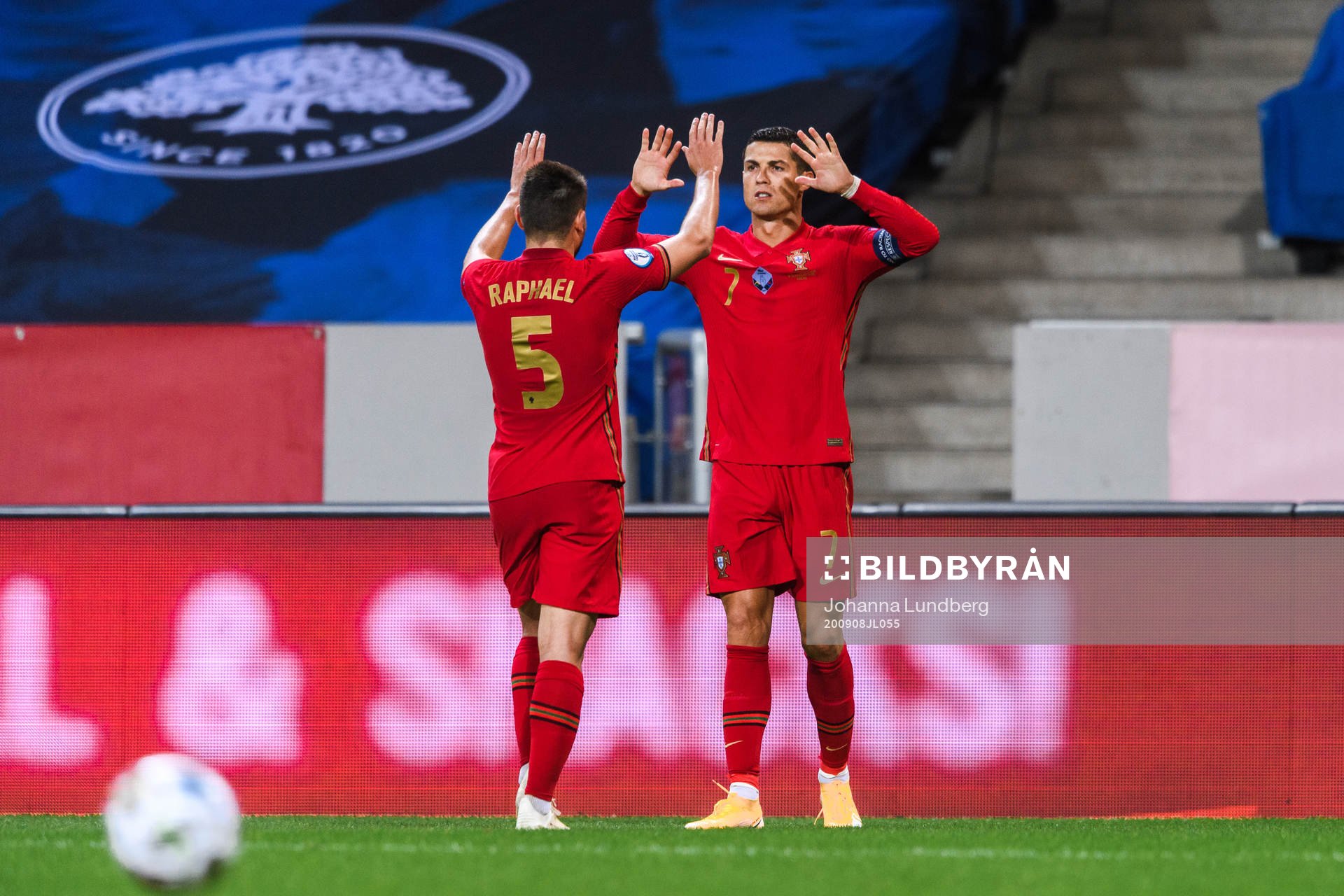 Raphael Guerreiro and Cristiano Ronaldo of Portugal
