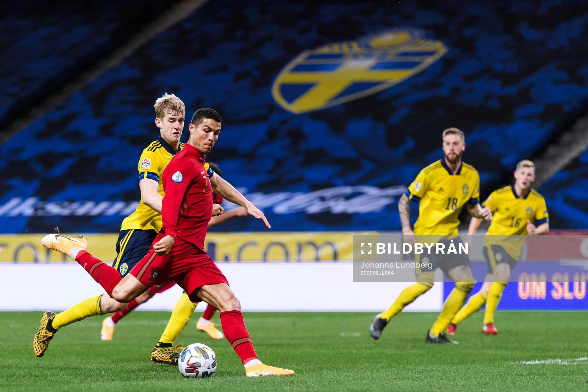 Filip Helander of Sweden and Cristiano Ronaldo of Portugal