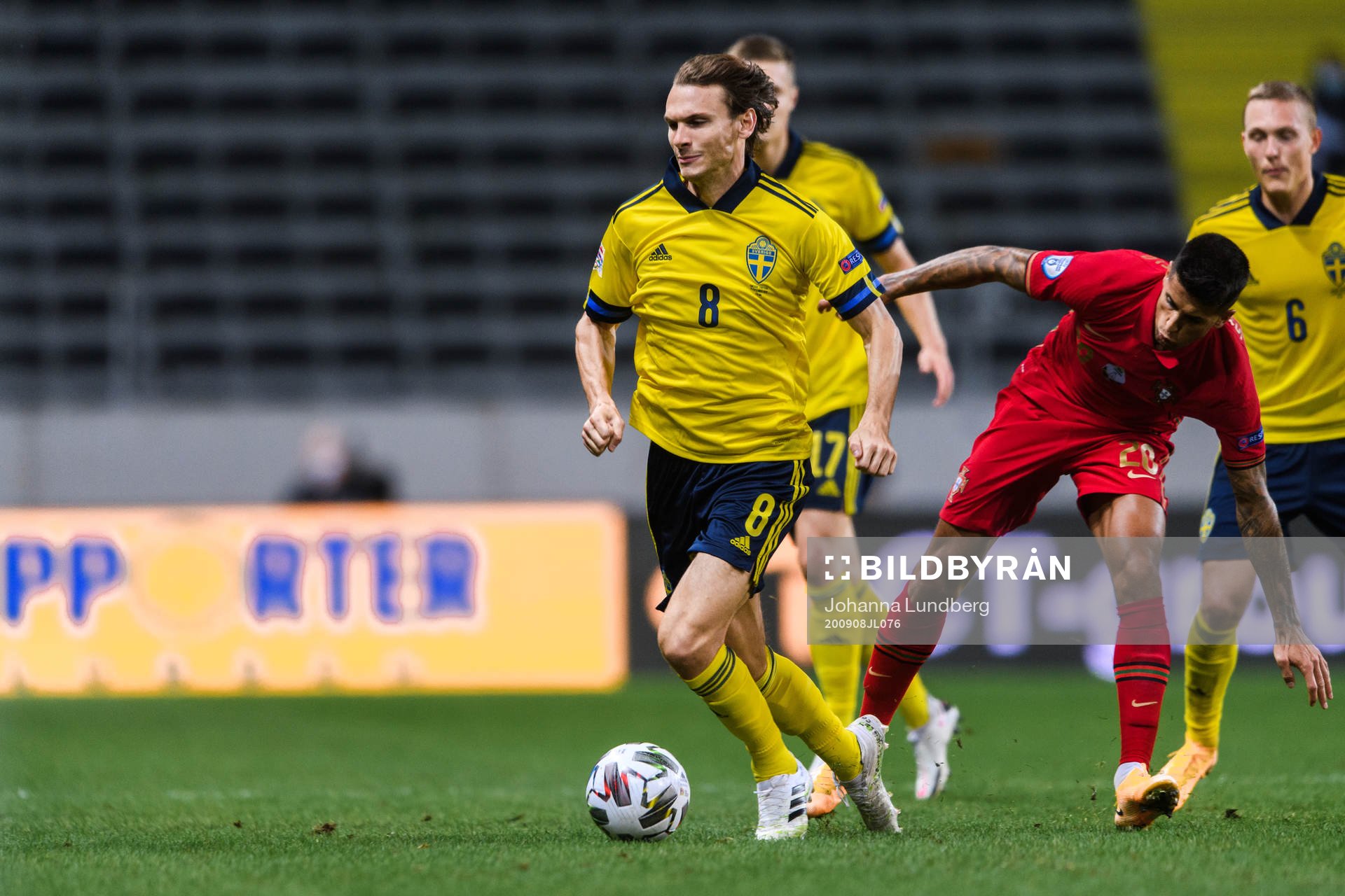 Albin Ekdal of Sweden and Joao Cancelo of Portugal