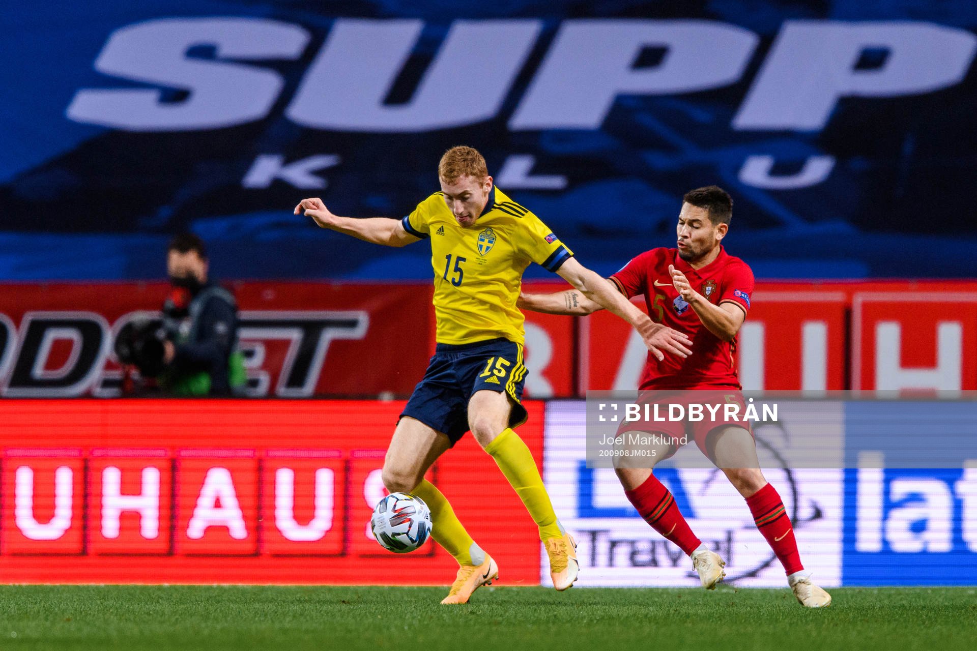 Dejan Kulusevski of Sweden and Raphael Guerreiro of Portugal