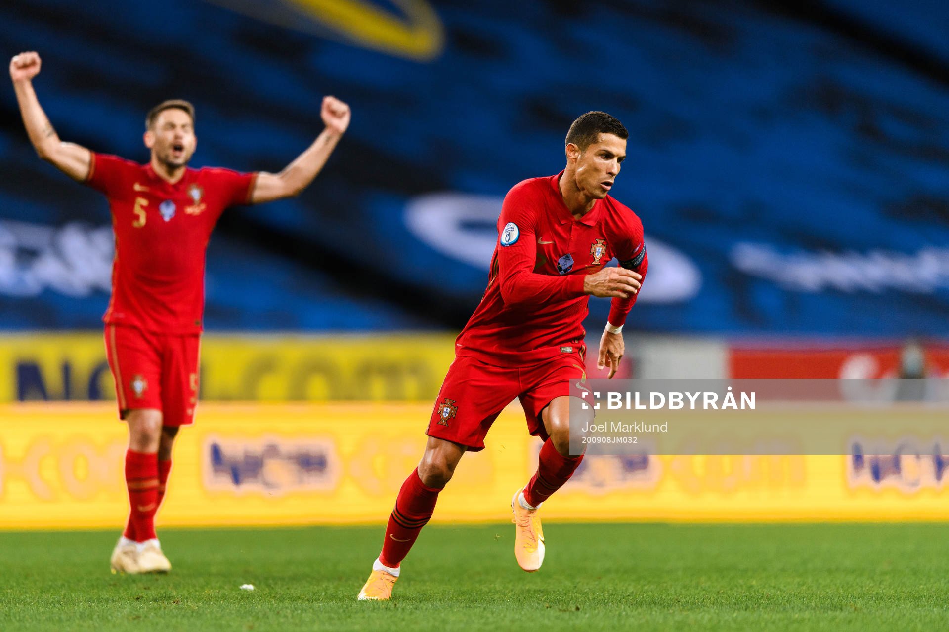 Raphael Guerreiro and Cristiano Ronaldo of Portugal